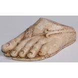 A museum type plaster cast, of a foot wearing a sandal, after the Ancient Greek example collected by