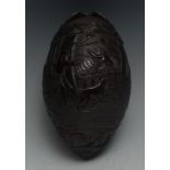 A 19th century coconut bugbear, well and profusely carved with gentlemen and dogs out hunting,