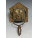 A 19th century bronze novelty door knocker, amusingly cast as a kennelled dog holding a mouse, 10.