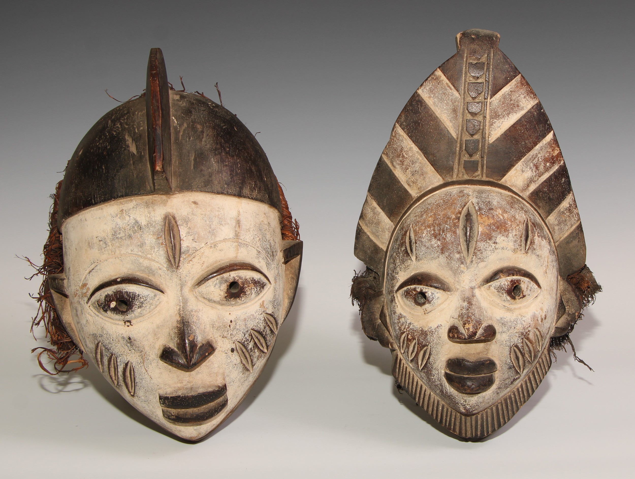 Decorative Tribal Art and the Eclectic Interior - a Baule mask, lofty stylised coiffure, scarified