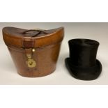 A 19th century leather top hat box, brass fittings, 35cm wide, c.1880; enclosing a silk top hat,