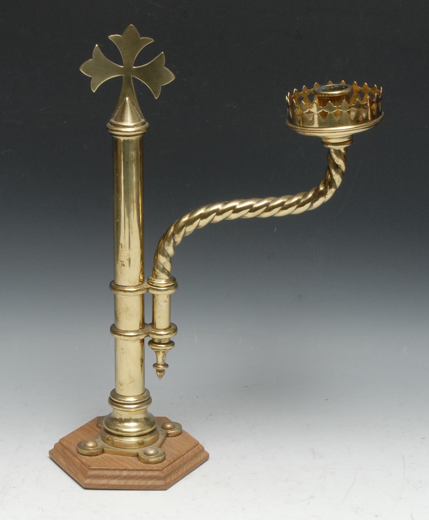 A Gothic Revival brass pulpit or lectern candlestick, the sconce and spiral branch adjustable on a