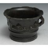 A 16th century bronze mortar, cast in relief with a band of dolphins, figures and geometric