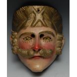 A Central American folk art mask, carved as a moustached man, possibly Tecun Uman, painted in