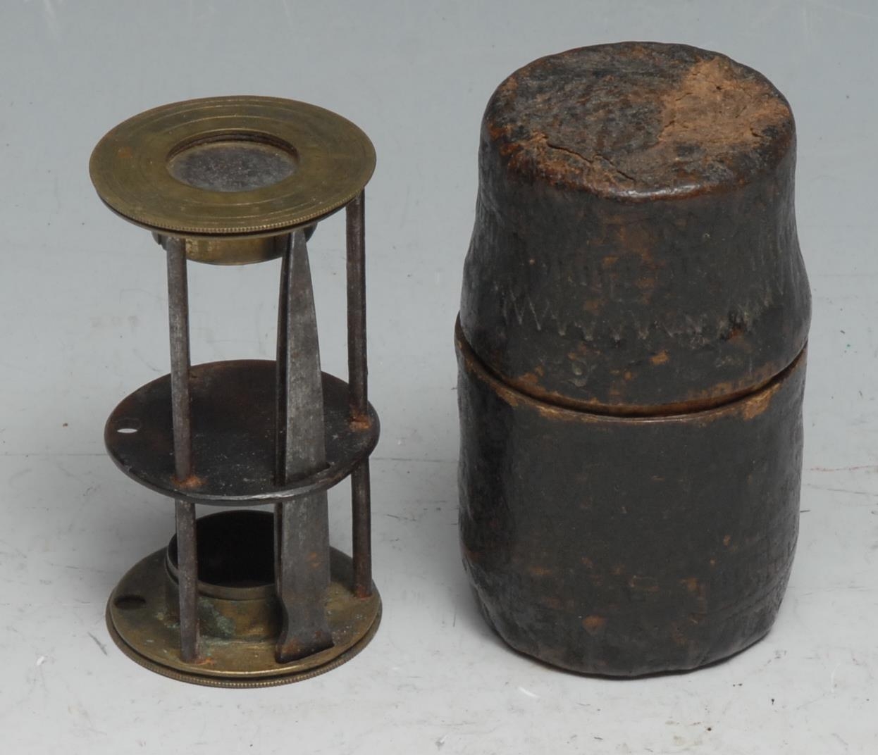 An 18th/19th century travelling pocket field microscope, tweezers ensuite, 6.5cm high, cylindrical