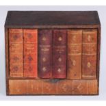 A tooled and gilt leather novelty library drinks cabinet, as a row of books, the titled bindings