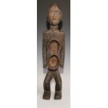 Decorative Tribal Art and the Eclectic Interior- an African power or fetish figure, figure-of-