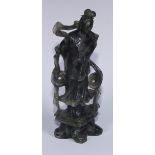 A Chinese carved jade figure, of a courtesan holding a rabbit, 29cm high; another, holding a fan,