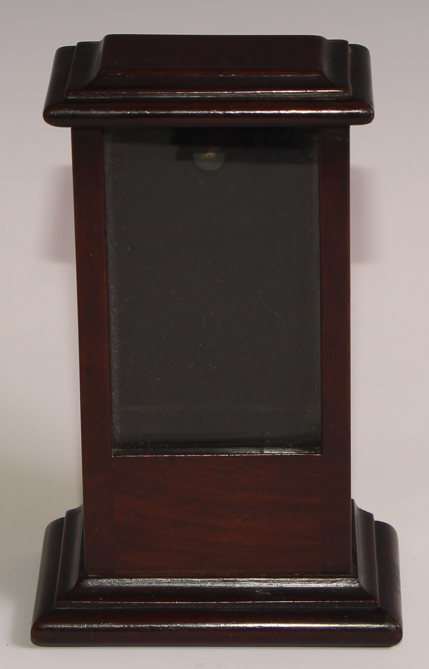 A 19th century mahogany cabinet-form pocket watch case, glazed aperture, fall-front compartment to