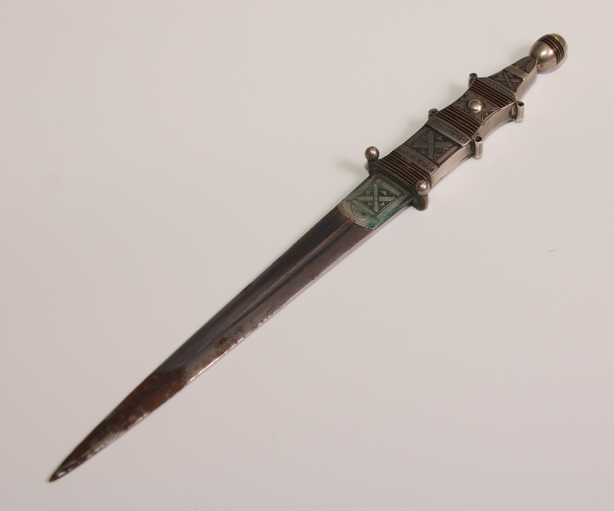 A Telek silver coloured metal dagger, 13.5cm pointed fullered blade, ovoid pommel, the scabbard - Image 4 of 5