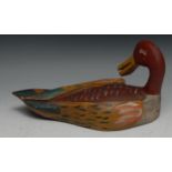 A painted softwood decoy duck, 32cm long