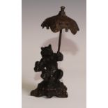 A bronze desk novelty, cast after Fratin as a bear, holding a parasol, 21cm high