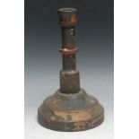 Treen - a turned and painted softwood candlestick, 25.5cm high