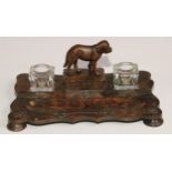A Victorian papier mache inkstand, scumbled in faux burr walnut and applied with brass cut-card