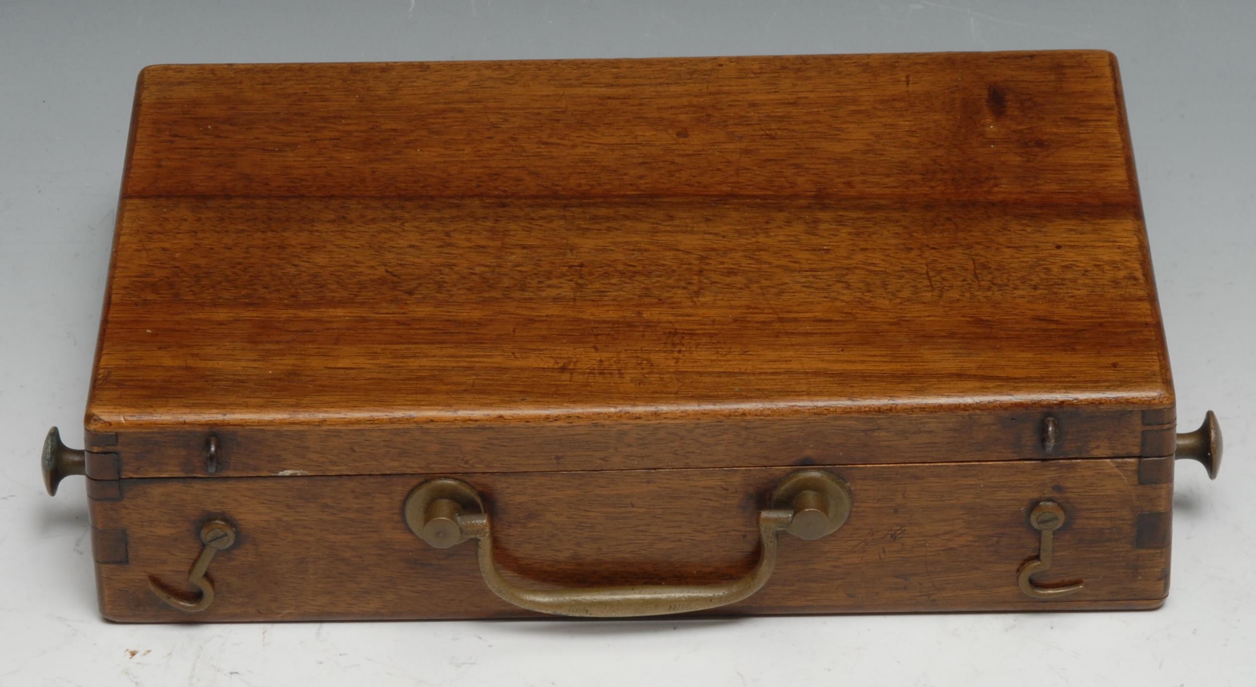 A late 19th century mahogany artist's paint box, hinged cover enclosing a palette, tube rack and