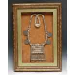A Middle Eastern silver coloured metal wedding necklace, hung with a Koran box and four Maria