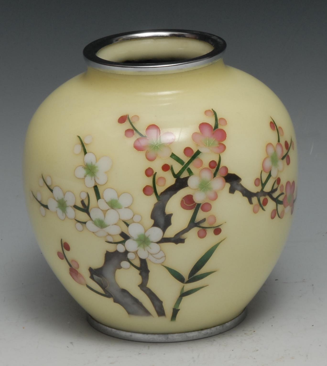 A Japanese cloisonne vase, decorated in polychrome with blossoming prunus on a pale yellow ground,