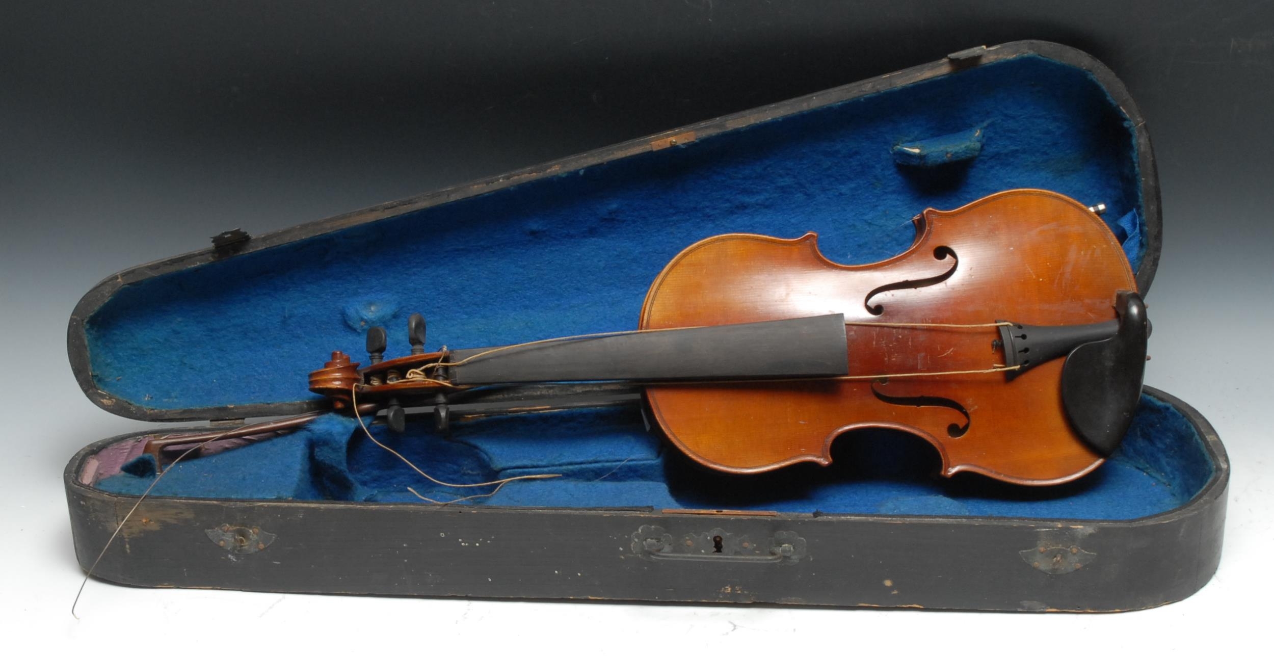 A violin, the one-piece back 33cm excluding button, Copie de Stradivarius label, ebony tuning