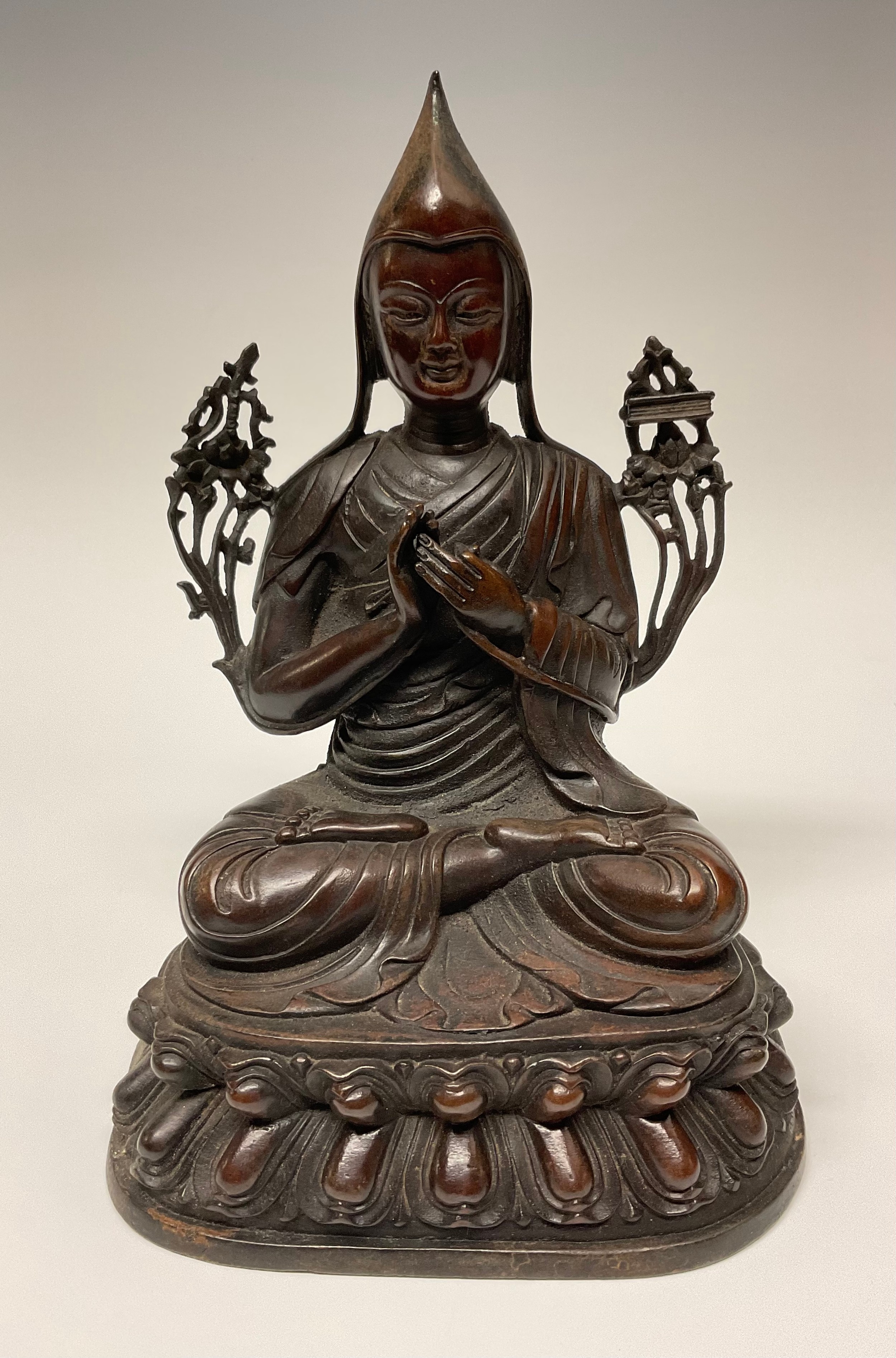Tibetan School, a bronze, Tsongkhapa, seated in meditation, lotus base, 23.5cm high