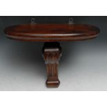 A Victorian mahogany wall bracket, oval plateau, the reeded scroll support applied with draught