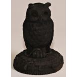 An Irish bog oak ink well carved as an owl, 12.5cm high, early 20th century