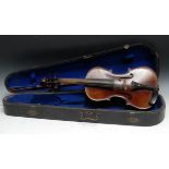 A violin, the two-piece back 35.5cm excluding button, ebony tuning pegs, outlined throughout with