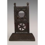 A 19th century Colonial pocket watch stand. carved with stylised leaves and a pierced roundel,