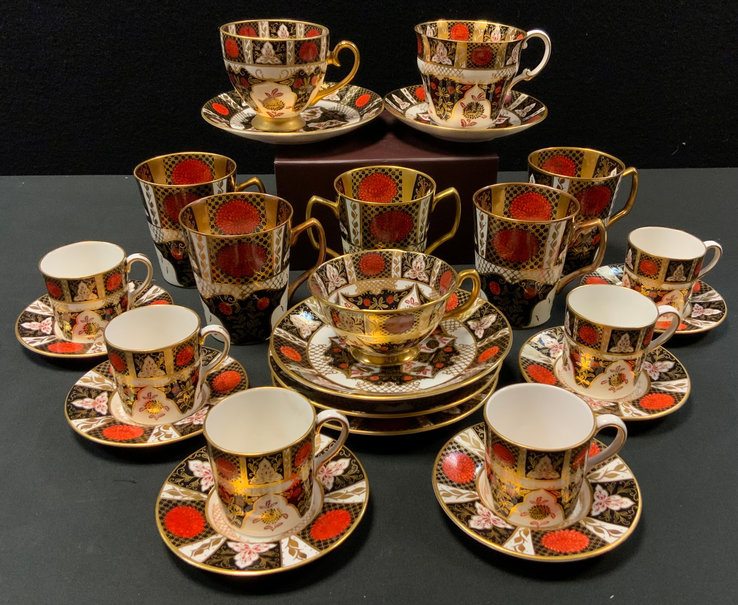 A set of six Abbeydale Chrysanthemum pattern coffee cups and saucers; four similar coffee mugs;