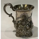 A Victorian silver cup, deeply embossed with fruit including Apples, Pineapple, Grapes, George