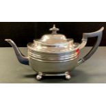 A silver boat shaped teapot, gadrooned border, ball feet, 13.5cm high., Thomas Bradbury & Sons