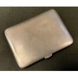 A George V Asprey silver cigarette case, engine turned body, Chester 1918, 8.4cm x 6cm, 100.8g gross