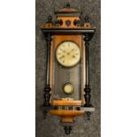 A Junghans small Vienna wall clock, walnut and ebonised wood case, painted brass face with Roman