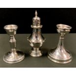 A silver boudoir candlestick, 10.5cm high, Birmingham 1924; another, 10.5cm high, Birmingham 1965; a