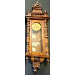 A late 19th century Vienna wall clock, cream dial, Arabic numerals, rearing Horse cresting, 125cm