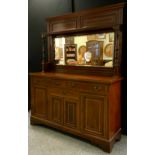 An Edwardian inlaid mahogany mirror back sideboard, shelved mirrored back, turned pilasters, above