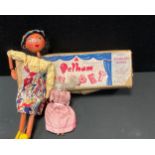 A Pelham puppet, Mexican Girl, Type SS, boxed; an early 20th century porcelain doll's house doll,