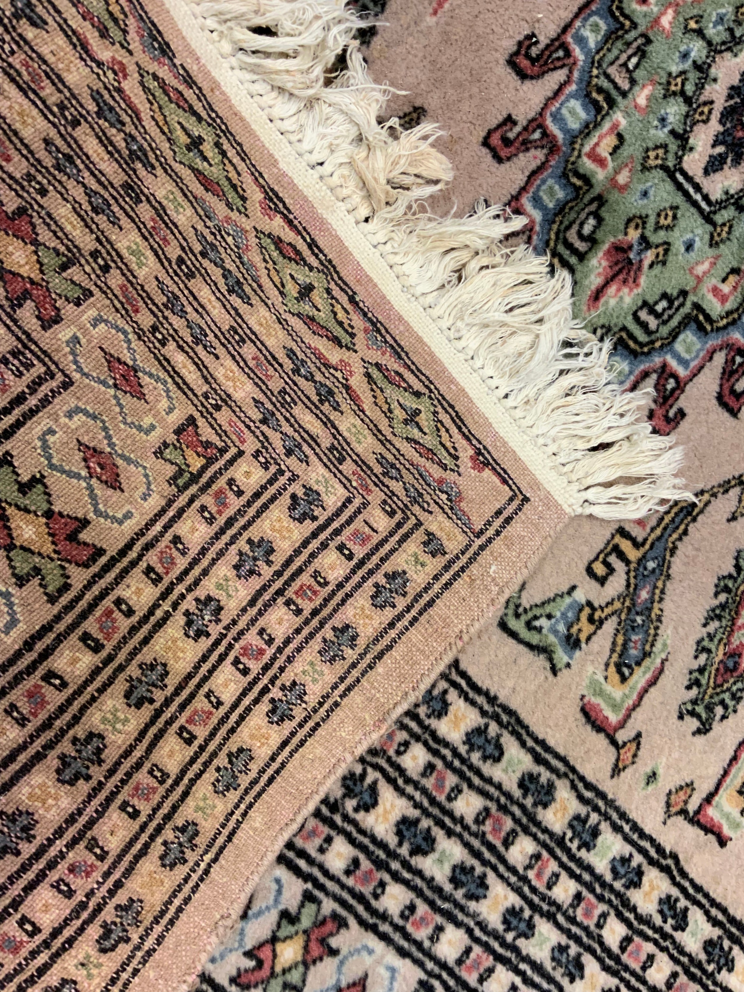 A middle eastern Bokhara, wool and silk mix rug / carpet, knotted with traditional ‘Gul’ motif, - Image 5 of 5