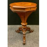 A Victorian inlaid sewing table, octagonal top, fitted interior, carved tripod supports, 70cm