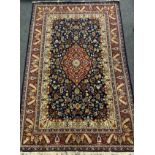 A Persian garden carpet, all over decorated with multi coloured floral motifs, blue ground, approx
