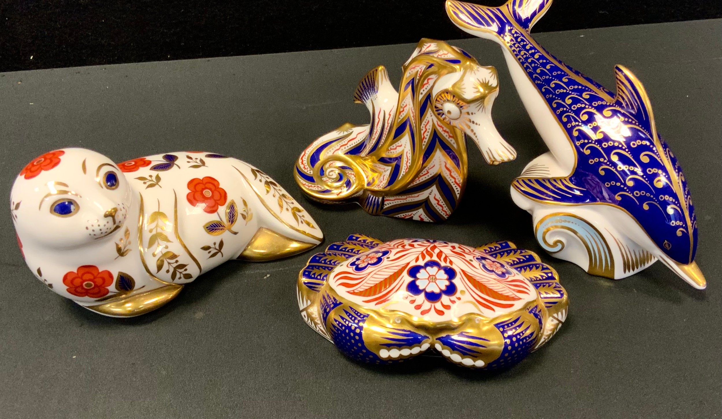 Royal Crown Derby Paperweights - Seahorse, Dolphin, Crab, all gold stoppers; Seal, silver stopper (