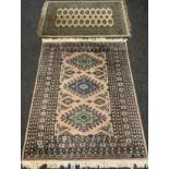 A middle eastern Bokhara, wool and silk mix rug / carpet, knotted with traditional ‘Gul’ motif,