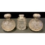 A pair of Victorian hobnail cut globular scent bottles, London marks, worn; another Chester (3)