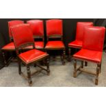 A set of four early 20th century oak dining chairs, red leather backs and seats, turned legs; and