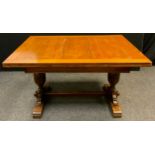 A mid 20th century oak draw-leaf trestle dining table, 77.5cm tall x 98.5cm wide x 133cm long (211cm