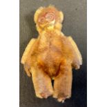 A Schuco mohair jointed monkey perfume bottle, 7.5cm high, c1920