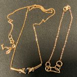 A 9ct gold fancy link necklace, set with a deep blue sapphire, stamped 375, (snapped); 9ct gold