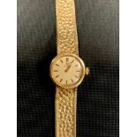 Omega - a 1970s lady's 9ct gold cased bracelet wristwatch, ref 1061, gilt dial, block baton markers,