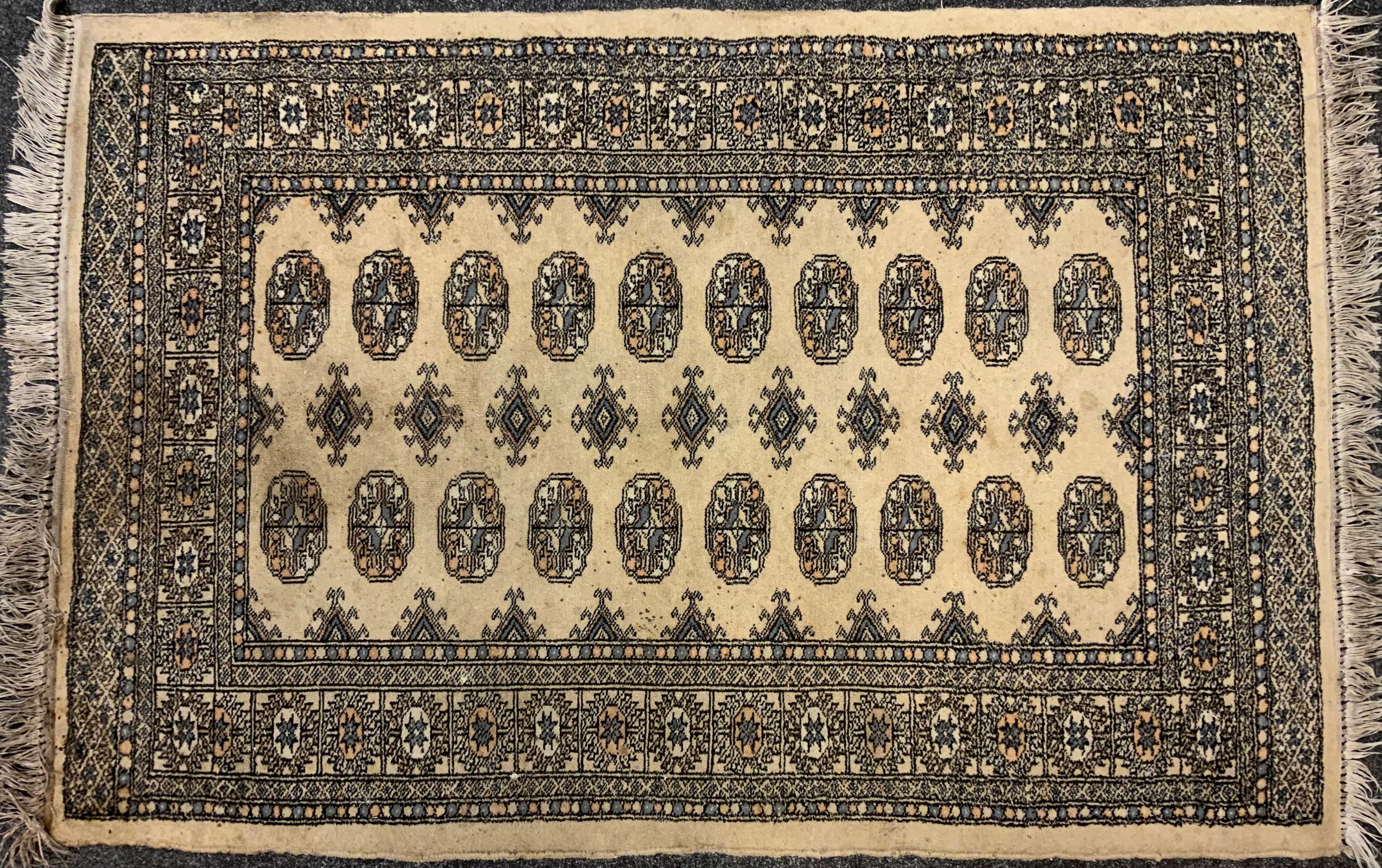 A middle eastern Bokhara, wool and silk mix rug / carpet, knotted with traditional ‘Gul’ motif, - Image 3 of 5