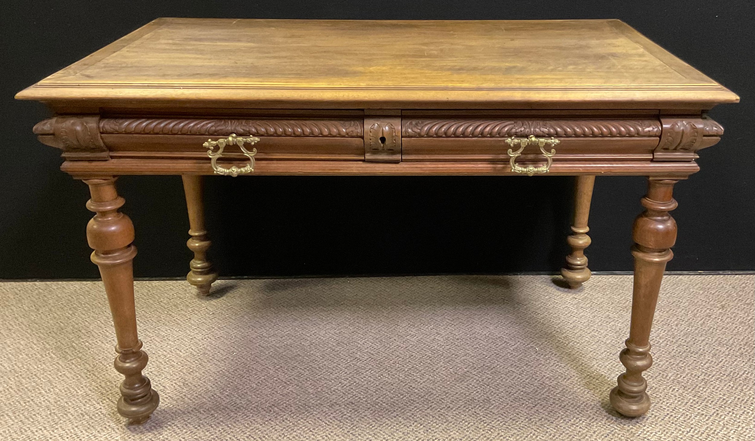 A French Provincial style walnut Lowboy side table, over-sailing top with moulded edge, pair of