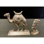An Egyptian silver model, standing Camel, impressed marks; a Nefertiti head seal stamp, impressed